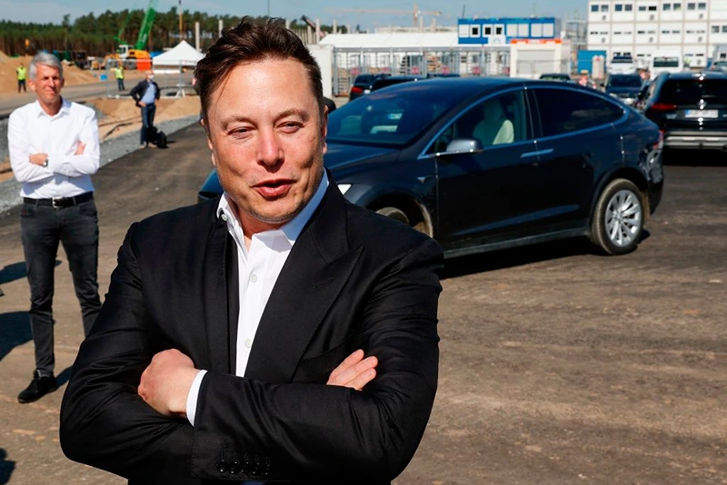 Tesla CEO Elon Musk talks to media as he arrives to visit the construction site of the future US electric car giant Tesla, on September 03, 2020 in Gruenheide near Berlin. - Tesla builds a compound at the site in Gruenheide in Brandenburg for its first European "Gigafactory" near Berlin. (Photo by Odd ANDERSEN / AFP) (Photo by ODD ANDERSEN/AFP via Getty Images)