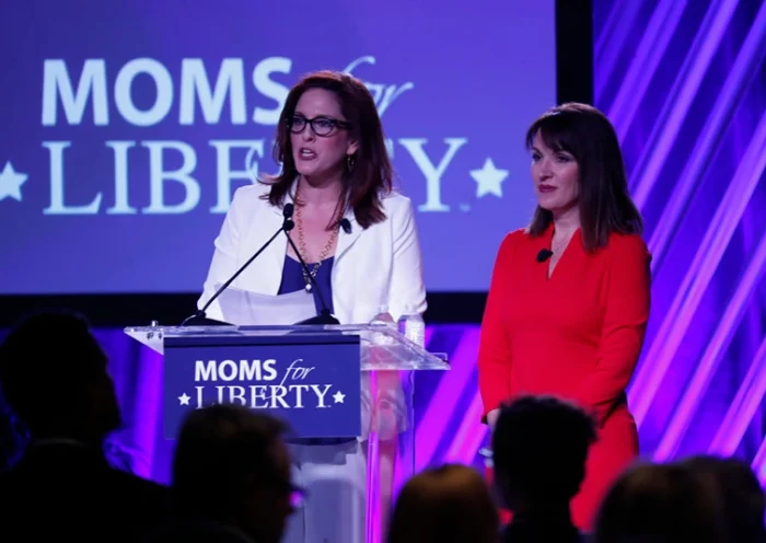 TAMPA, FL - JULY 15: Moms for Liberty founders Tiffany Justice (L) and Tina Descovich give the opening remarks before Florida Governor Ron DeSantis speaks during the inaugural Moms For Liberty Summit at the Tampa Marriott Water Street on July 15, 2022 in Tampa, Florida. DeSantis is up for reelection in the 2022 Gubernatorial race against Democratic frontrunner Rep. Charlie Crist (D-FL). (Photo by Octavio Jones/Getty Images)