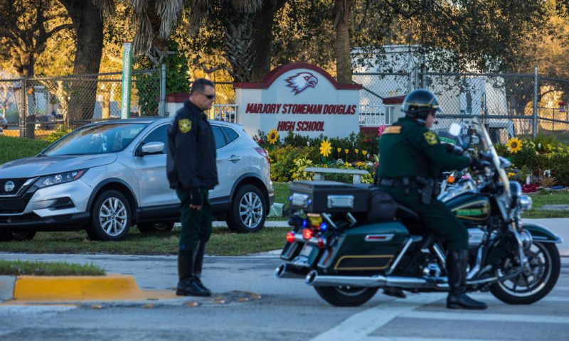 Police outside of Marjory Stoneman Douglas High School on February 14, 2023 in Parkland, Florida. Today marks the 5th anniversary of the school shooting that took the lives of 17 students. (Photo by Saul Martinez/Getty Images)