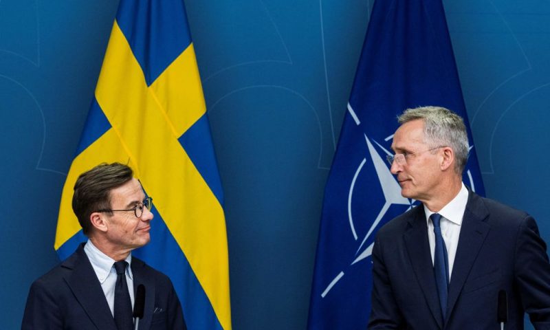 NATO Secretary General Jens Stoltenberg (R) and Swedish Prime Minister Ulf Kristersson look at each other as they address a joint press conference in Stockholm on March 7, 2023, following a meeting with all Swedish party leaders who are in favor of a Swedish NATO membership. (Photo by Jonathan NACKSTRAND / AFP) (Photo by JONATHAN NACKSTRAND/AFP via Getty Images)