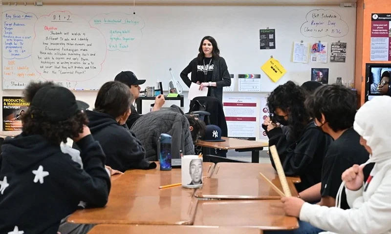 Instructor Brittany Hilgers (R standing) teaches a ninth grade Film class, part of the Roybal Film and Television Production Magnet program at the Edward R. Roybal Learning Center in Los Angeles, California, on March 8, 2023. - The program was launched in September 2022 by actor George Clooney and advisory board members such as actors Don Cheadle and Eva Longoria to foster diversity in Hollywood. (Photo by Frederic J. BROWN / AFP) (Photo by FREDERIC J. BROWN/AFP via Getty Images)