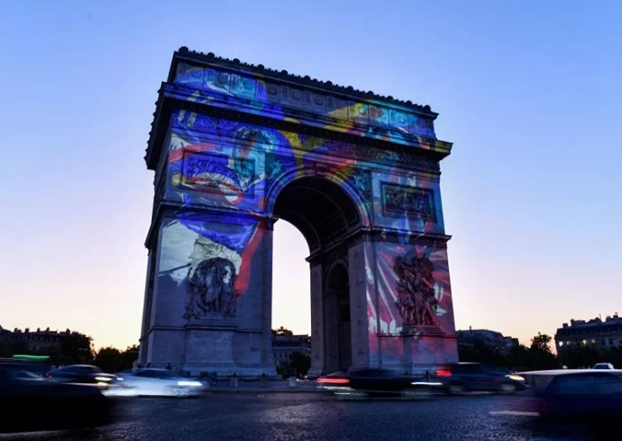 A rugby illustration is projected on Arc de Triomphe to mark 100 days before the start of the France 2023 Rugby World Cup, in Paris, on May 31, 2023. (Photo by JULIEN DE ROSA / AFP) (Photo by JULIEN DE ROSA/AFP via Getty Images)