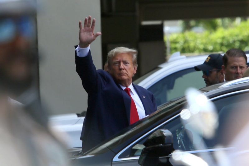 MIAMI, FLORIDA - JUNE 13: Former U.S. President Donald Trump waves as he makes a visit to the Cuban restaurant Versailles after he appeared for his arraignment on June 13, 2023 in Miami, Florida. Trump pleaded not guilty to 37 federal charges including possession of national security documents after leaving office, obstruction, and making false statements. (Photo by Alon Skuy/Getty Images)