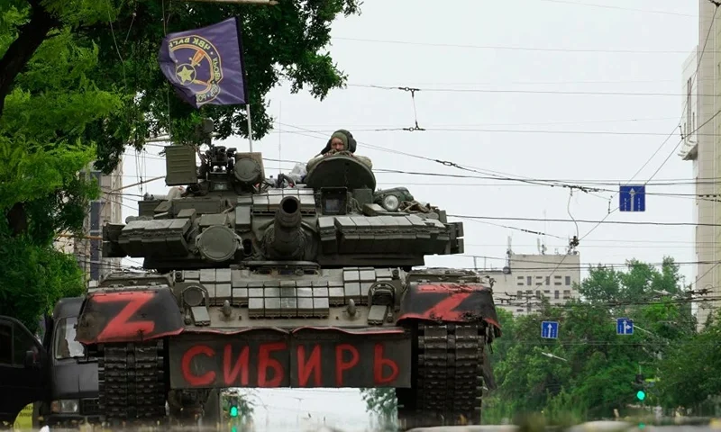 TOPSHOT - Members of Wagner group sit atop of a tank in a street in the city of Rostov-on-Don, on June 24, 2023. President Vladimir Putin on June 24, 2023 said an armed mutiny by Wagner mercenaries was a "stab in the back" and that the group's chief Yevgeny Prigozhin had betrayed Russia, as he vowed to punish the dissidents. Prigozhin said his fighters control key military sites in the southern city of Rostov-on-Don. (Photo by STRINGER / AFP) (Photo by STRINGER/AFP via Getty Images)
