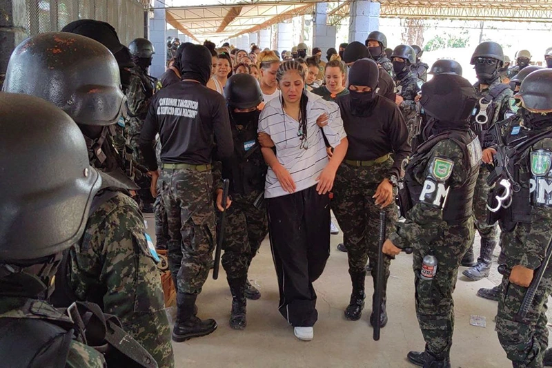 Members of the Military Police of Public Order (PMOP) take control of the Women's Social Adaptation Center (CEFAS) prison in Tamara, 25 km north of Tegucigalpa, on June 26, 2023. The government announced last week that military police would assume control of Honduras's 21 prisons for a period of one year starting July 1, as well as train 2,000 new prison guards after a vicious battle between rival gangs left at least 46 women dead in a prison near the capital Tegucigalpa. (Photo by STRINGER / AFP) (Photo by STRINGER/AFP via Getty Images)