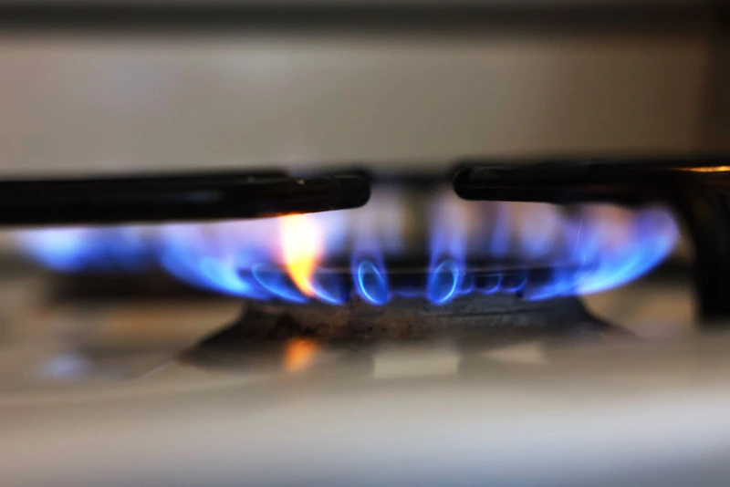 NEW YORK, NEW YORK - APRIL 28: In this photo illustration, a flame burns on a gas stove on April 28, 2023 in New York City. Gov. Kathy Hochul announced that starting in 2026, New York will require new buildings to be zero-emissions as part of this year’s budget and ban fossil fuel combustion in most new buildings under seven stories, with larger buildings covered in 2029. The ban will eliminate propane heating and gas furnaces or stoves in most new construction. (Photo Illustration by Michael M. Santiago/Getty Images)