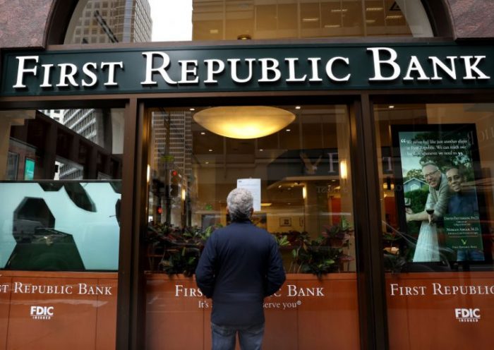 SAN FRANCISCO, CALIFORNIA - MAY 01: A passerby stops to read a posted announcement from the FDIC about the seizure of First Republic Bank and sale to JPMorgan Chase on May 01, 2023 in San Francisco, California. Federal Regulators seized troubled lender First Republic Bank on Monday and sold all of its deposits and most of its assets to JPMorgan Chase. First Republic becomes the second largest bank in U.S. history to fail since Washington Mutual failed in 2008. (Photo by Justin Sullivan/Getty Images)
