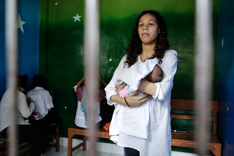 Heather Mack, 19, of the US holds her baby in a cell before her sentence demand trial on March 31, 2015 in Denpasar, Bali, Indonesia. Indonesian prosecutors asked a court to sentence Heather Mack to 15 years and Tommy Schaefer to 18 years in jail. Tommy Schaefer and his girlfriend Heather Mack are accused of murdering Mack's mother, Sheila von Wiese-Mack, whose body was found stuffed inside a suitcase in the back of a taxi outside a luxury Bali hotel in August 2014. (Photo by Agung Parameswara/Getty Images)