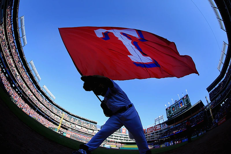 ARLINGTON, TEXAS - APRIL 04: Captain, the Texas Rangers mascot, waves the team flag after the Texas Rangers beat the Seattle Mariners 3-2 on Opening Day at Globe Life Park in Arlington on April 4, 2016 in Arlington, Texas. (Photo by Tom Pennington/Getty Images)