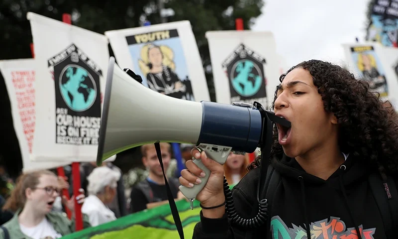 SAN RAMON, CALIFORNIA - SEPTEMBER 27: A youth climate activist uses a bullhorn as she leads a chant during a Climate Strike youth protest outside of Chevron headquarters on September 27, 2019 in San Ramon, California. Hundreds of youth climate activists and their supporters staged a Climate Strike protest outside of Chevron headquarters calling for the company to abandon fossil fuels by 2025. (Photo by Justin Sullivan/Getty Images)