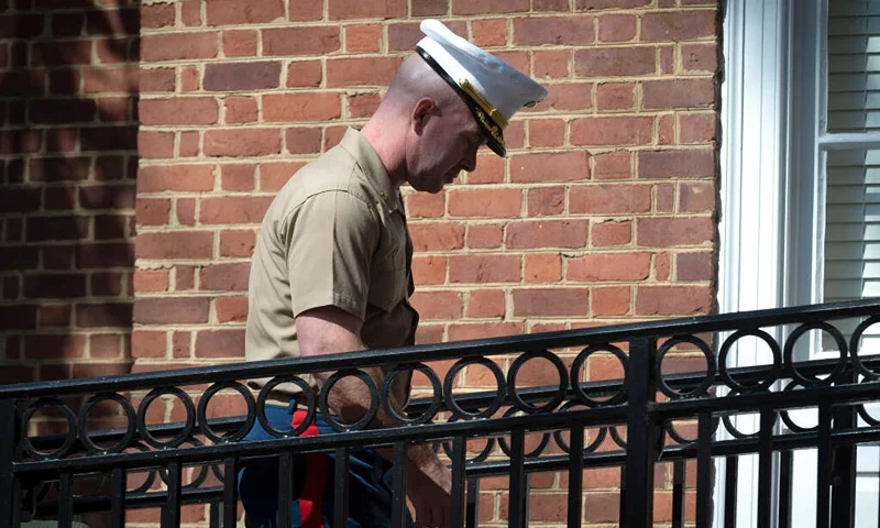 Marine Maj. Joshua Mast, arrives at Circuit Court, Thursday, March 30, 2023 in Charlottesville, Va. In a highly unusual ruling, a state court judge on Thursday voided a U.S. Marine’s adoption of an Afghan war orphan, more than a year after he took the little girl away from the Afghan couple raising her. But her future remains uncertain. (AP Photo/Cliff Owen)