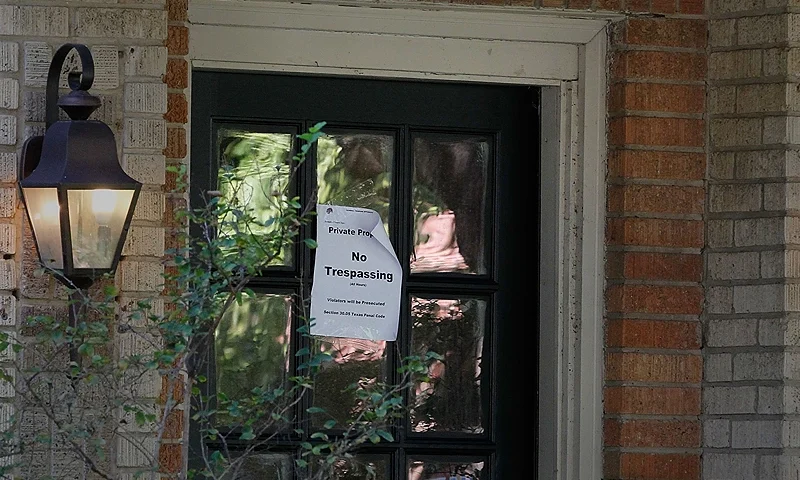DALLAS, TX - OCTOBER 14: A 'no trespassing' sign hangs on the apartment building where health care worker Nina Pham, who cotnracted the Ebola virus, resides on October 14, 2014 in Dallas, Texas. Pham contracted the virus when she provided treatment to Thomas Eric Duncan, the West African man who later died from the disease. (Photo by Mike Stone/Getty Images)