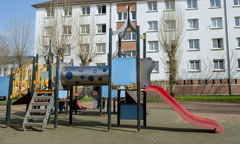A photo taken on April 16, 2015 in the northern city of Calais shows the building where Chloe, a nine-year-old girl who was snatched on April 15 in front of her mother from the playground, lived. France was in shock on April 16 after a nine-year-old girl was found dead in a wood shortly after being snatched in front of her mother from a playground in the northern city of Calais. A Polish man with a long criminal history, who had been banned from French territory, has admitted to raping and murdering the girl, sources close to the investigation told AFP. The 38-year-old was arrested on Wednesday night near the woods where her naked, lifeless body was found. Chloe was playing with a friend when a man "appeared and grabbed her, forcing her to get into a red car," prosecutors said in a statement. AFP PHOTO PHILIPPE HUGUEN (Photo credit should read PHILIPPE HUGUEN/AFP via Getty Images)