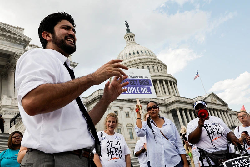 U.S. Rep. Greg Casar (D-TX) talks to supporters during the sixth hour of a thirst strike outside the U.S. Capitol to protest a new Texas state law signed by Republican Governor Greg Abbott blocking local ordinances that mandate water breaks for workers, on Capitol Hill in Washington, U.S., July 25, 2023. REUTERS/Jonathan Ernst

