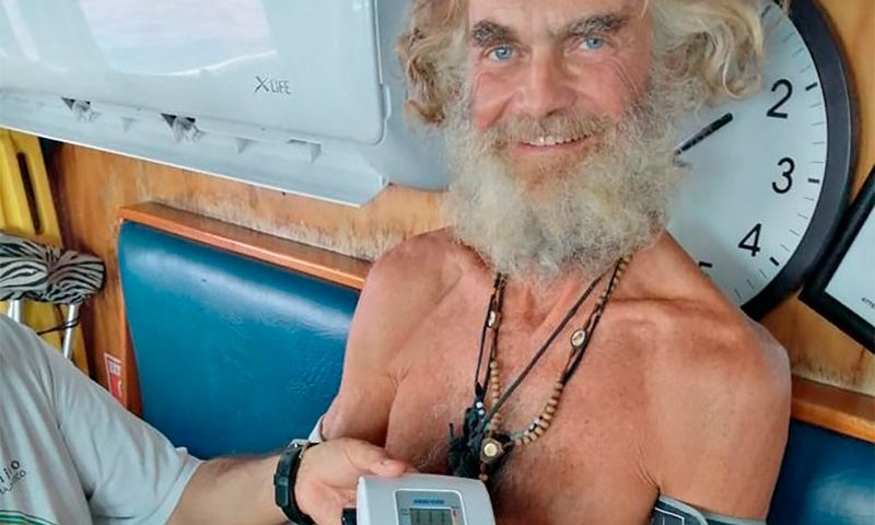 In this July 12, 2023 photo provided by Grupomar/Atun Tuny, Australian Tim Shaddock has is blood pressure taken after being rescued by a Mexican tuna boat in international waters, after being adrift with his dog for three months. Haddock and his dog Bella were aboard his incapacitated catamaran Aloha Toa some 1,200 miles from land when they were rescued. (Grupomar/Atun Tuny via AP)