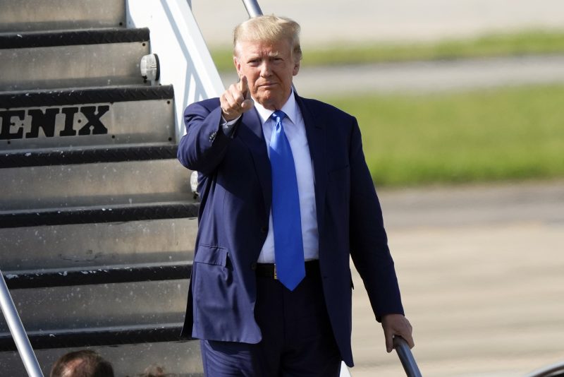 Former President Donald Trump arrives at New Orleans International Airport in New Orleans, Tuesday, July 25, 2023. (AP Photo/Gerald Herbert)
