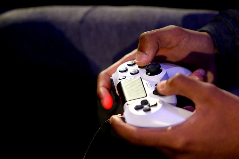 LONDON, ENGLAND - MARCH 28: A detailed view of a PS4 controller as players practice during day one of the 2019 ePremier League Finals at Gfinity Arena on March 28, 2019 in London, England. (Photo by Alex Pantling/Getty Images)