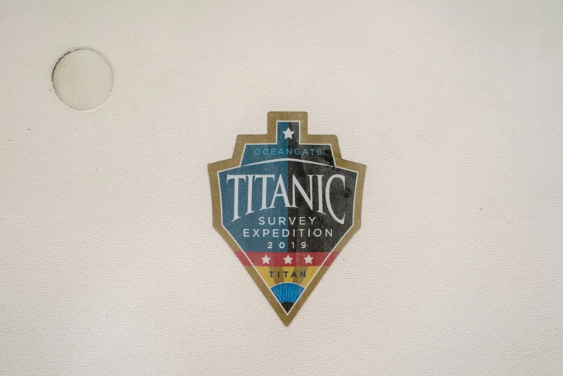 EVERETT, WASHINGTON - JUNE 21: A sticker from a 2019 Titanic survey expedition is seen in a window of the OceanGate offices on June 21, 2023 in Everett, Washington. OceanGate, owner of the missing submersible carrying five people trying to visit the Titanic wreckage in the North Atlantic, operates out of Everett. (Photo by David Ryder/Getty Images)