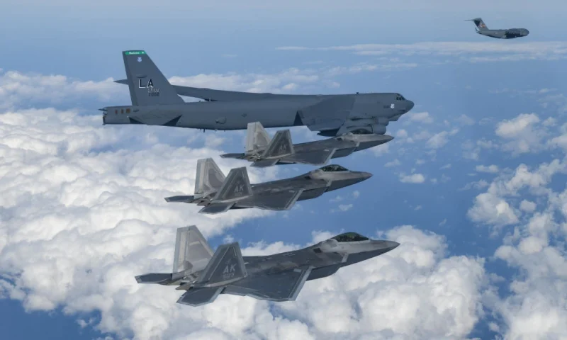 UNDISCLOSED LOCATION, SOUTH KOREA - DECEMBER 20: In this handout image released by the South Korean Defense Ministry, A U.S. B-52H strategic bomber, F-22 fighter jets and C-17 fly over South Korea during the joint air drills on December 20, 2022 at an undisclosed location in South Korea. South Korea and the United States conducted combined air drills, involving a U.S. B-52 strategic bomber and F-22 stealth fighters. The drills took place in the South's air defense identification zone southwest of its southern island of Jeju aimed at bolstering allies' deterrence against evolving North Korean threats. (Photo by South Korean Defense Ministry via Getty Images)