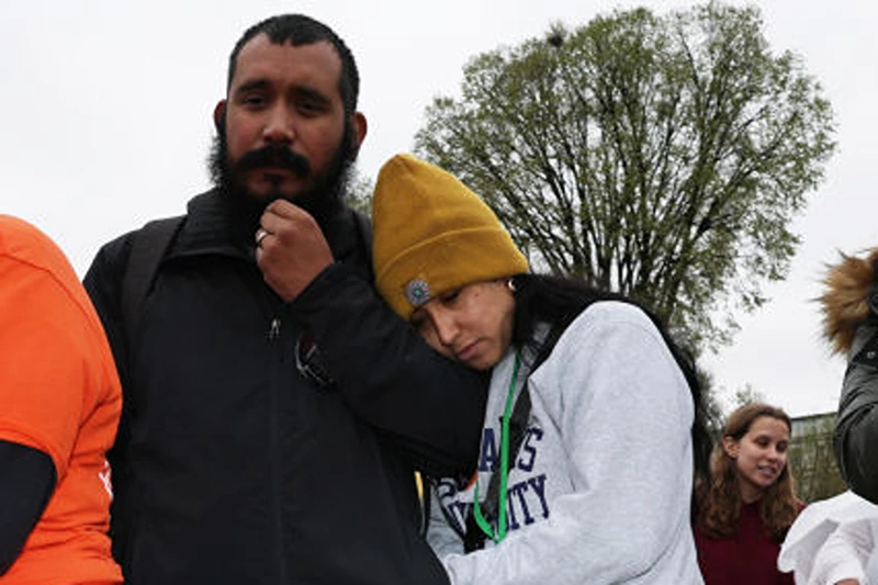 WASHINGTON, DC - MARCH 24: Kimberly Mata-Rubio and Felix Rubio (C), parents of Uvalde mass school shooting victim Alexandra “Lexi” Rubio, listen to remarks during a “Generation Lockdown” event on gun control at the National Mall on March 24, 2023 in Washington, DC. Gun control activists gathered for a rally to call on the Senate to pass S.25, the federal assault weapons ban. (Photo by Alex Wong/Getty Images)