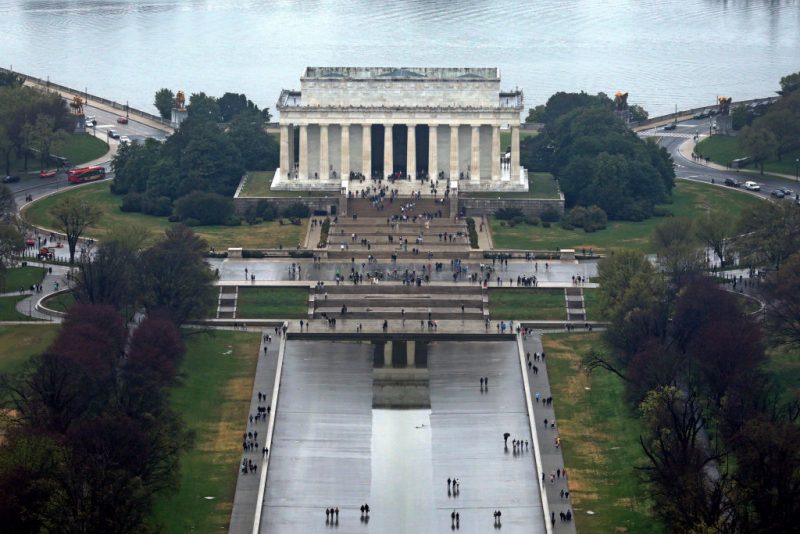 WASHINGTON, DC - MARCH 25: An aerial view of the Lincoln Memorial is seen during high tide amid cherry blossoms in peak bloom on March 25, 2023 in Washington, DC. According to a new report from the National Oceanic and Atmospheric Administration (NOAA), climate change and rising sea levels are expected to threaten the root systems of cherry trees near the Tidal Basin. The National Park Service predicted that peak bloom happens from March 22 to March 25 this year. (Photo by Alex Wong/Getty Images)
