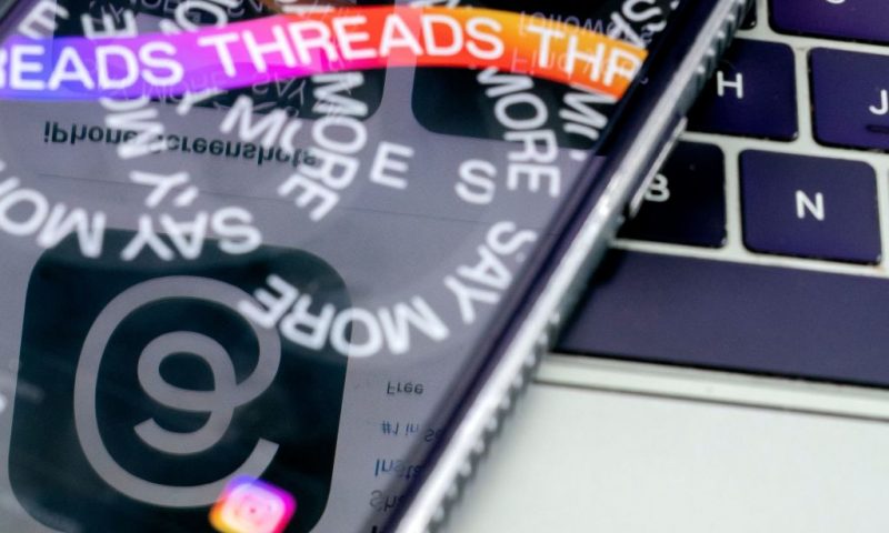 This photo illustration created in Washington, DC, on July 6, 2023, shows the logo of Threads, an Instagram app, reflected in its opening page. More than 10 million people have signed up to Threads, Meta's rival to Twitter, within the first few hours of its launch, the company's CEO Mark Zuckerberg said July 6. The app went live on Apple and Android app stores in 100 countries at 2300 GMT on July 5, 2023, and will run with no ads for now, but its release in Europe has been delayed over data privacy concerns. (Photo by Stefani Reynolds / AFP) (Photo by STEFANI REYNOLDS/AFP via Getty Images)