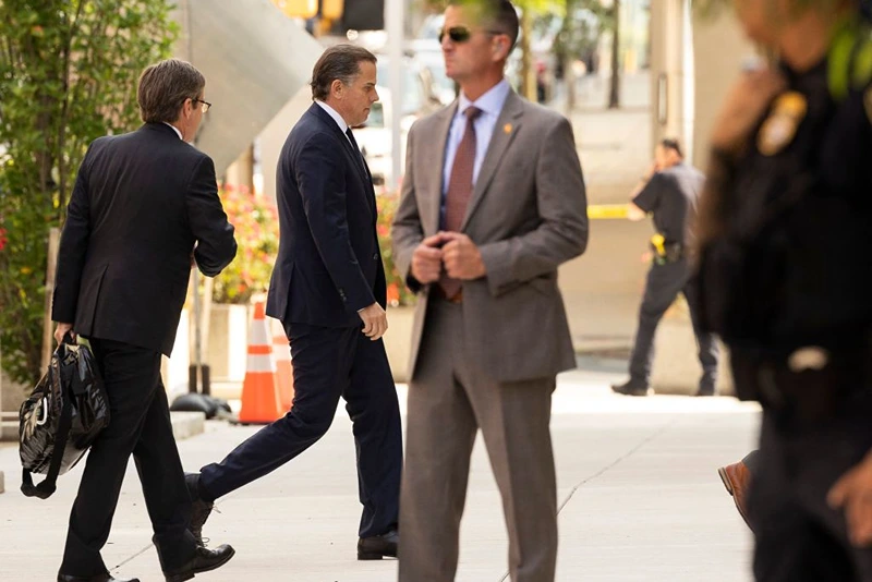 Hunter Biden (2nd L), son of US President Joe Biden, arrives at the J. Caleb Boggs Federal Building in Wilmington, Delaware, on July 26, 2023, to attend a change of plea hearing. Hunter Biden faces two misdemeanor charges for failure to pay taxes. The hearing is also expected to address an agreement between federal prosecutors and Biden to avoid prosecution for a felony charge of illegally possessing a firearm. (Photo by RYAN COLLERD / AFP) / ALTERNATIVE CROP (Photo by RYAN COLLERD/AFP via Getty Images)