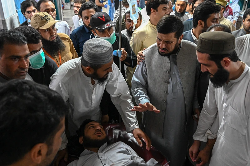 TOPSHOT-PAKISTAN-BLAST
TOPSHOT - Haji Ghulam Ali (2nd R), governor of KP province greets an injured man in a hospital in Peshawar on July 30, 2023, after at least 44 people were killed and dozens more wounded by a suicide bombing at a political gathering of a leading Islamic party in northwest Pakistan. The blast targeted the Jamiat Ulema-e-Islam-F (JUI-F) party -- a government coalition partner led by an influential firebrand cleric -- as hundreds of supporters congregated under a canopy in the town of Khar, near the Afghan border. (Photo by Abdul MAJEED / AFP) (Photo by ABDUL MAJEED/AFP via Getty Images)