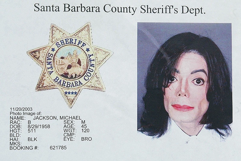 SANTA BARBARA, UNITED STATES: (FILES)This photo shows a police mug shot taken of US pop star Michael Jackson at the Santa Barbara Sheriff's booking office in Santa Barbara, California after Jackson surrendered himself there, 20 November 2003. Jackson was booked on suspicion of child molestation and released on three million USD bail. Jackson will be formally charged with child molestation on 18 or 19 December 2003, nearly a month after his dramatic arrest, the chief prosecutor said 16 December. The long-awaited charges against the "King of Pop," who turned himself in to police on 20 November on "multiple counts" of sex abuse on a child under 14, will be filed in the California town of Santa Maria, near his Neverland ranch."Charges against Michael Jackson will be filed at Santa Barbara County Superior Court, Santa Maria Division", District Attorney Tom Sneddon said. AFP PHOTO/Robyn BECK (Photo credit should read ROBYN BECK/AFP via Getty Images)