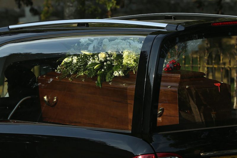 A close-up view of a coffin as a funeral cortege carrying the victims of last Friday's terrorist attack in Tunisia drives through the village of Brize Norton after arriving at the nearby RAF airbase on July 1, 2015 in Brize Norton, England. British nationals Adrian Evans, Charles Evans, Joel Richards, Carly Lovett, Stephen Mellor, John Stollery and Denis and Elaine Thwaites are the first of the victims of last week's terror attack to be repatriated. (Photo by Dan Kitwood/Getty Images)