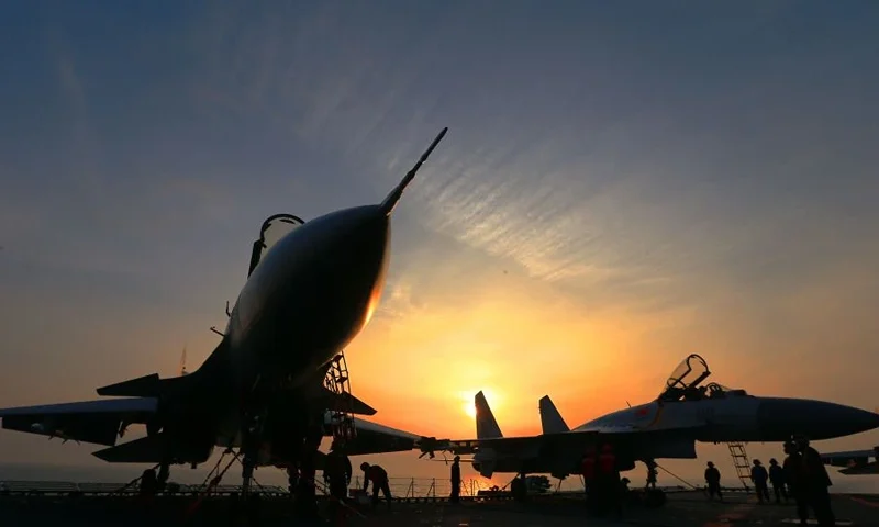 This photo taken on April 24, 2018 shows J15 fighter jets on China's sole operational aircraft carrier, the Liaoning, during a drill at sea. - A flotilla of Chinese naval vessels held a "live combat drill" in the East China Sea, state media reported early April 23, 2018, the latest show of force by Beijing's burgeoning navy in disputed waters that have riled neighbours. (Photo by - / AFP) / China OUT (Photo credit should read -/AFP via Getty Images)