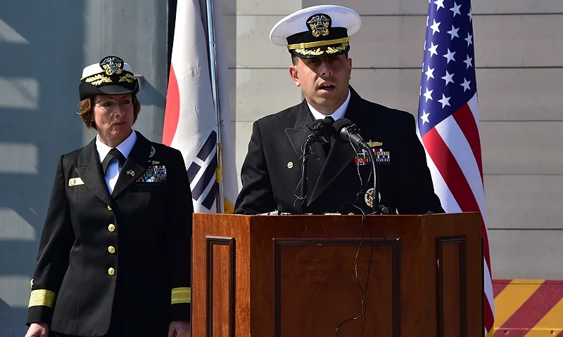 US Rear Admiral Matt Kawas (R), commander of the USS Fort Worth (LCS 3), speaks as US Rear Admiral Lisa Franchetti (L), commander of US Naval Forces Korea, looks on during a media tour on board at a South Korean naval port in the southeastern port city of Busan on March 14, 2015. USS Fort Worth is the first US Navy Littoral Combat Ship to visit Korea and is participating in the annual Foal Eagle exercise with the Republic of Korea navy. AFP PHOTO / POOL / JUNG YEON-JE (Photo credit should read JUNG YEON-JE/AFP via Getty Images)