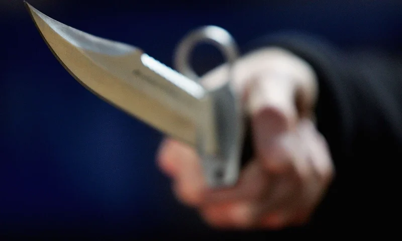 LONDON, DECEMBER 13: A hunting knife is held by an employee at a film and television prop company December 13, 2004 in London, England. Families of stabbing victims have called on the government to make carrying a knife as serious an offence as carrying a gun, with a minimum five-year jail term for carrying a knife with a blade longer than three inches. (Photo Illustration by Ian Waldie/Getty Images)