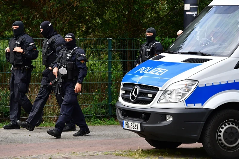 BREMEN, GERMANY - JULY 23: Heavily armed police forces, equipped with Heckler & Koch MP5 machine gun, secure the funeral of Hells Angels motorcycle member Rainer Kopperschmidt at Walle cemetery on July 23, 2020 in Bremen, Germany. Kopperschmidt founded the first German branch of the Hells Angels in Hamburg in 1973. The Hells Angels have a strong following in Germany and have a role in the country's organized crime, including the drug trade, prostitution and illegal weapons trade. (Photo by Alexander Koerner/Getty Images)
