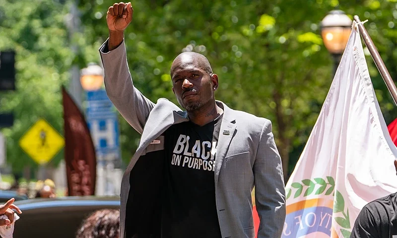 ATLANTA, GA - JUNE 18: Khalid Kamau, Mayor of South Fulton, Georgia, raises his fist while participating in the Juneteenth Atlanta Black History parade on June 18, 2022 in Atlanta, Georgia. Juneteenth, or Emancipation Day, commemorates the end of chattel slavery on June 19, 1865 in Galveston, Texas, in compliance with President Lincoln's 1863 Emancipation Proclamation. In 2021, U.S. President Joe Biden signed a law declaring Juneteenth a federal holiday. (Photo by Elijah Nouvelage/Getty Images)