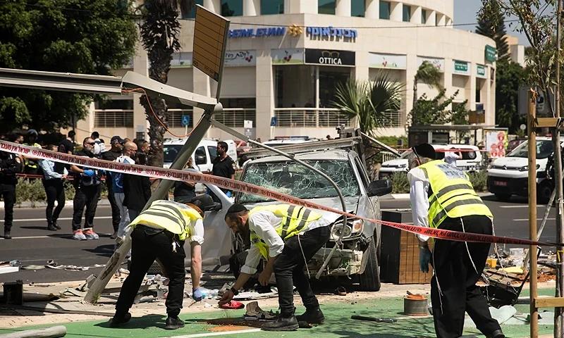 TEL AVIV, ISRAEL - JULY 04: Israeli security and rescue forces examine the scene of a terror attack on July 4, 2023 in Tel Aviv, Israel. Several people were injured after a car rammed into pedestrians, the driver then stabbed several people before being neutralised, according to Israeli officials. (Photo by Amir Levy/Getty Images)