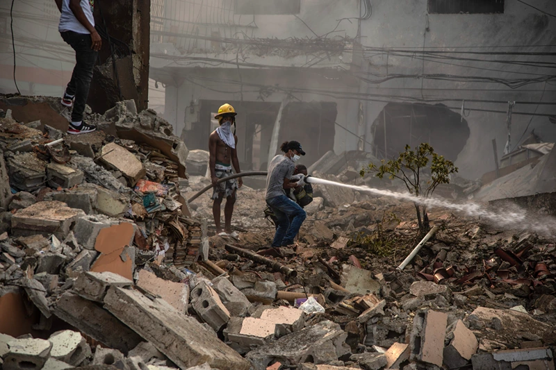 Dominican Republic Explosion
Firefighters put out a fire after a powerful explosion in San Cristobal, Dominican Republic, Monday, Aug 14, 2023. The Monday afternoon explosion killed at least three people and injured more than 30 others, authorities said. (Jolivel Brito/Diario Libre via AP)