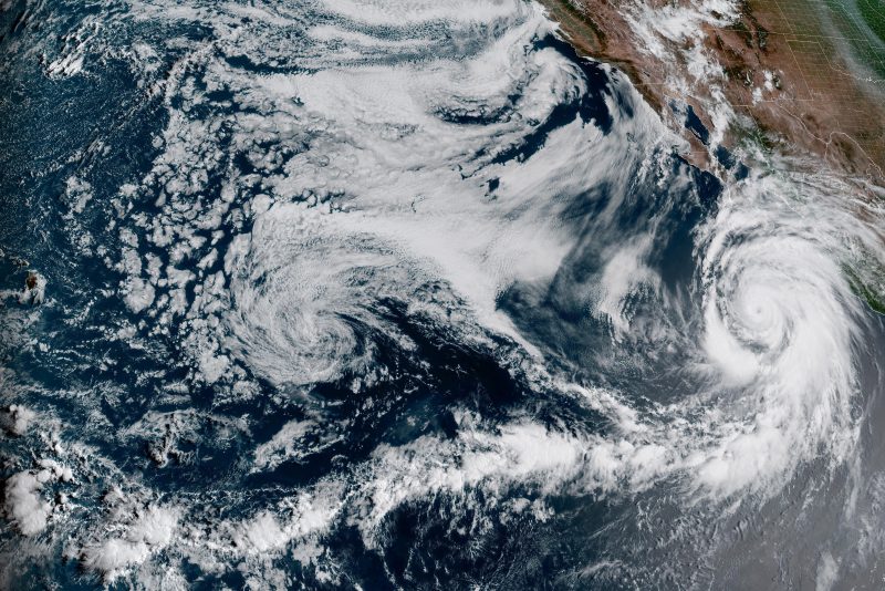 This Friday, Aug. 18, 2023, 1:10 p.m. EDT satellite image provided by the National Oceanic and Atmospheric Administration shows Hurricane Hilary, right, off Mexico’s Pacific coast. It grew rapidly to Category 4 strength and could reach Southern California as the first tropical storm there in 84 years, causing “significant and rare impacts” including extensive flooding. The U.S. National Hurricane Center said a tropical storm watch has been issued for Southern California, the first time it has ever done that. (NOAA via AP)