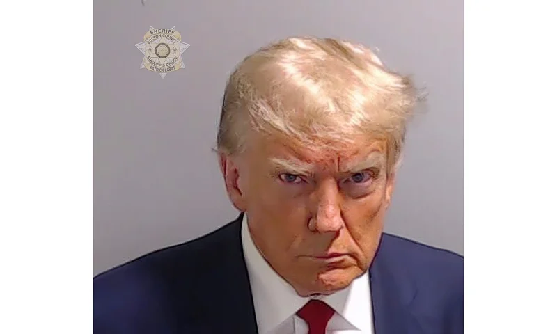 This booking photo provided by Fulton County Sheriff's Office, shows former President Donald Trump on Thursday, Aug. 24, 2023, after he surrendered and was booked at the Fulton County Jail in Atlanta. Trump is accused by District Attorney Fani Willis of scheming to subvert the will of Georgia voters in a desperate bid to keep Joe Biden out of the White House. (Fulton County Sheriff's Office via AP)