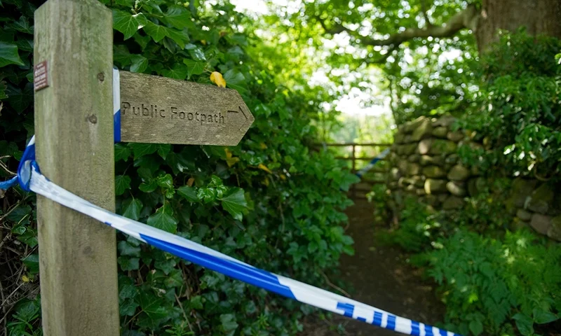 Police tape marks off a public footpath Police tape marks off a public footpath in a wooded area in Boot, near Seascale in Cumbria, north-west England, on June 3, 2010. Friends and neighbours of Derrick Bird, whose body was found in a wooded area of Boot after he killing 12 people on a shooting spree in northern England on Tuesday June 12, 2010, have expressed shock that a "normal bloke" could wreak such devastation. AFP PHOTO/Leon Neal (Photo credit should read LEON NEAL/AFP via Getty Images)