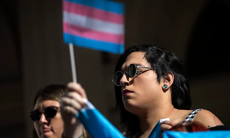 NEW YORK, NY - OCTOBER 24: L.G.B.T. activists and their supporters rally in support of transgender people on the steps of New York City Hall, October 24, 2018 in New York City. The group gathered to speak out against the Trump administration's stance toward transgender people. Last week, The New York Times reported on an unreleased administration memo that proposes a strict biological definition of gender based on a person's genitalia at birth. (Photo by Drew Angerer/Getty Images)