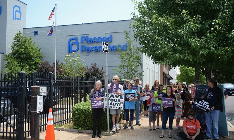 Anti-Abortion Groups Rally Outside Last Planned Parenthood Clinic In Missouri ST LOUIS, MO - JUNE 04: A group of demonstrators display signs during a pro-life rally outside the Planned Parenthood Reproductive Health Center on June 4, 2019 in St Louis, Missouri. The fate of Missouri's lone abortion clinic could be decided today in St. Louis Circuit Court after a restraining order prohibiting Missouri from letting the clinic's license lapse was granted last week. (Photo by Michael B. Thomas/Getty Images)