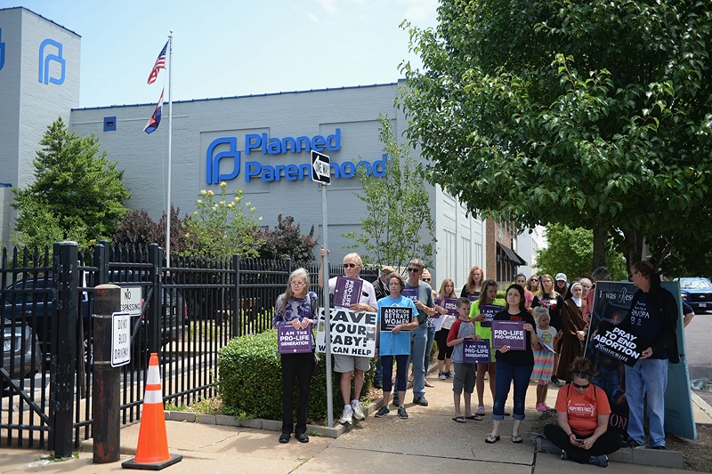 Anti-Abortion Groups Rally Outside Last Planned Parenthood Clinic In Missouri
ST LOUIS, MO - JUNE 04: A group of demonstrators display signs during a pro-life rally outside the Planned Parenthood Reproductive Health Center on June 4, 2019 in St Louis, Missouri. The fate of Missouri's lone abortion clinic could be decided today in St. Louis Circuit Court after a restraining order prohibiting Missouri from letting the clinic's license lapse was granted last week. (Photo by Michael B. Thomas/Getty Images)