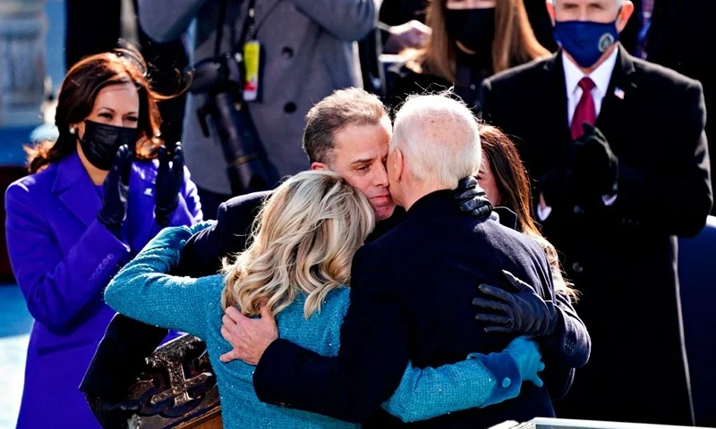 US President Joe Biden(R) is comforted by his son Hunter Biden and First Lady Jill Biden after being sworn in during the 59th presidential inauguration in Washington, DC on the West Front of the US Capitol on January 20, 2021 in Washington, DC. - During today's inauguration ceremony Joe Biden became the 46th president of the United States. (Photo by Kevin Dietsch / POOL / AFP) (Photo by KEVIN DIETSCH/POOL/AFP via Getty Images)