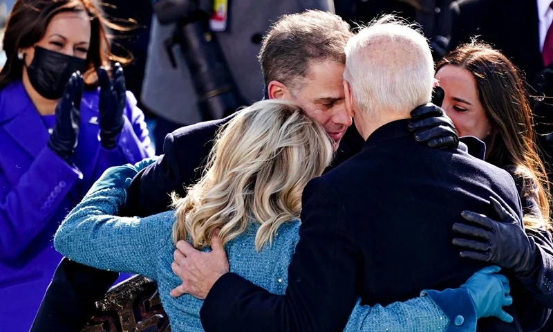 TOPSHOT - US President Joe Biden(R) is comforted by his son Hunter Biden and First Lady Jill Biden after being sworn in during the 59th presidential inauguration in Washington, DC on the West Front of the US Capitol on January 20, 2021 in Washington, DC. - During today's inauguration ceremony Joe Biden became the 46th president of the United States. (Photo by Kevin Dietsch / POOL / AFP) (Photo by KEVIN DIETSCH/POOL/AFP via Getty Images)