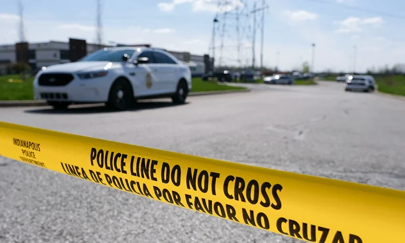 US-crime-shooting Police caution tape blocks the entrance to the site of a mass shooting at a FedEx facility in Indianapolis, Indiana on Friday, April 16, 2021. - A gunman has killed at least eight people at the facility before turning the gun on himself in the latest in a string of mass shootings in the country, authorities said. The incident came a week after President Joe Biden branded US gun violence an "epidemic" and an "international embarrassment" as he waded into the tense debate over gun control, a powerful political issue in the US. (Photo by Jeff Dean / AFP) (Photo by JEFF DEAN/AFP via Getty Images)