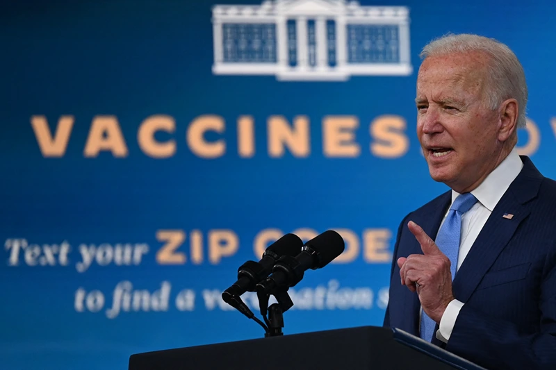 US-HEALTH-VIRUS-POLITICS-BIDEN
US President Joe Biden delivers remarks on the Covid-19 response and the vaccination program at the White House on August 23, 2021 in Washington,DC. - The US Food and Drug Administration on Monday fully approved the Pfizer-BioNTech Covid vaccine, a move that triggered a new wave of vaccine mandates as the Delta variant batters the country.Around 52 percent of the American population is fully vaccinated, but health authorities have hit a wall of vaccine hesitant people, impeding the national campaign. (Photo by Jim WATSON / AFP) (Photo by JIM WATSON/AFP via Getty Images)