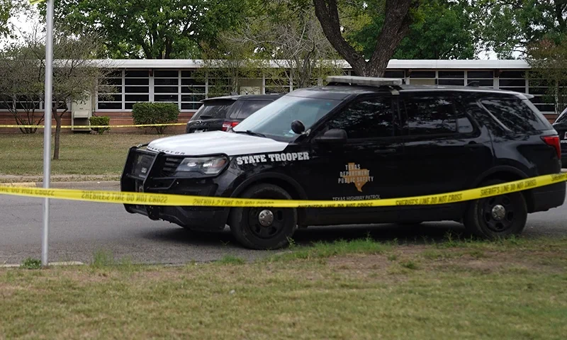 TOPSHOT-US-SCHOOL-CRIME-TEXAS TOPSHOT - Sheriff crime scene tape is seen outside of Robb Elementary School as State troopers guard the area in Uvalde, Texas, on May 24, 2022. - An 18-year-old gunman killed 14 children and a teacher at an elementary school in Texas on Tuesday, according to the state's governor, in the nation's deadliest school shooting in years. (Photo by allison dinner / AFP) (Photo by ALLISON DINNER/AFP via Getty Images)