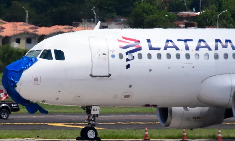 A Latam Airlines plane is pictured after an emergency landing on the eve at Silvio Pettirossi International Airport in Luque, Paraguay, on October 27, 2022. - A Chilean-Brazilian airline Latam plane with 48 passengers on board made an emergency landing in Luque at midnight on October 26 without an engine and with serious damage after flying through a severe storm, Paraguayan authorities said on October 27. (Photo by NORBERTO DUARTE / AFP) (Photo by NORBERTO DUARTE/AFP via Getty Images)