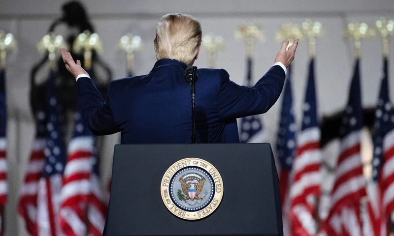 WASHINGTON, DC - AUGUST 27: U.S. President Donald Trump turns to gesture toward the White House while delivering his acceptance speech for the Republican presidential nomination on the South Lawn August 27, 2020 in Washington, DC. Trump gave the speech in front of 1500 invited guests. (Photo by Chip Somodevilla/Getty Images)